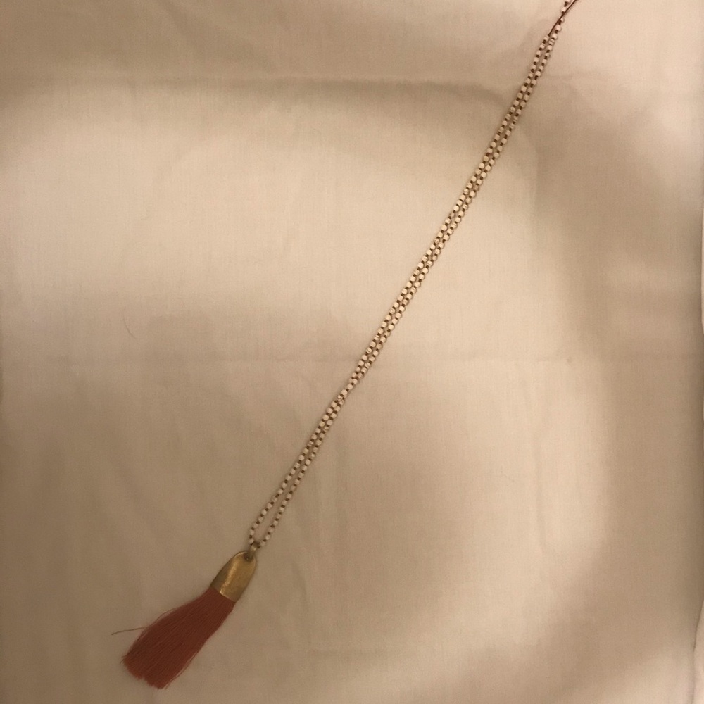 Orange tassel necklace. Never been worn